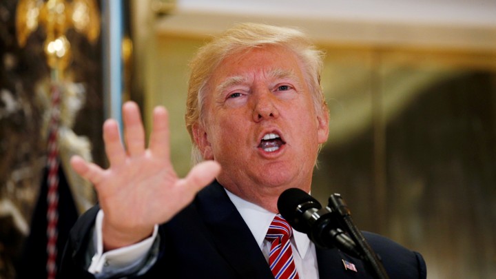 Donald Trump gestures at a press conference in Trump Tower.