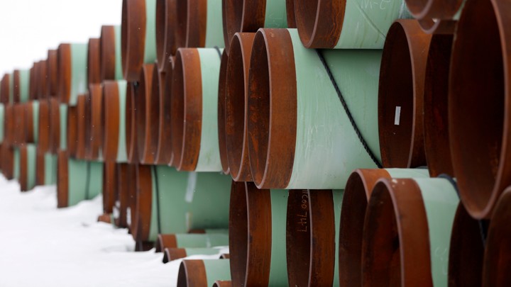 Large pipes stacked in snow