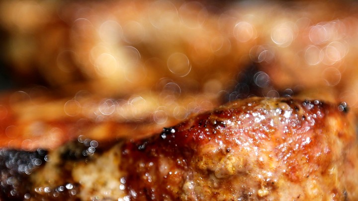 A close-up of a sizzling pork steak