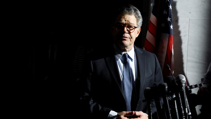 Senator Al Franken speaks to reporters outside his office in Washington on Monday.
