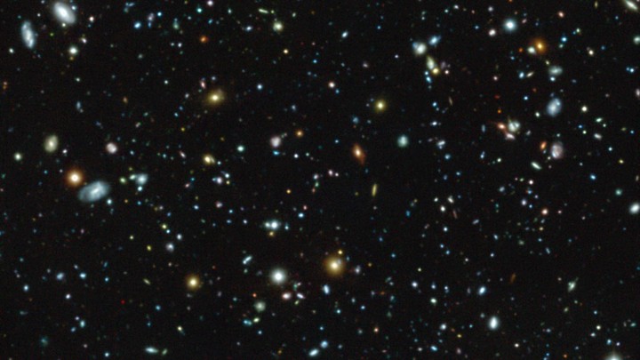 An image of galaxies and star clusters in space