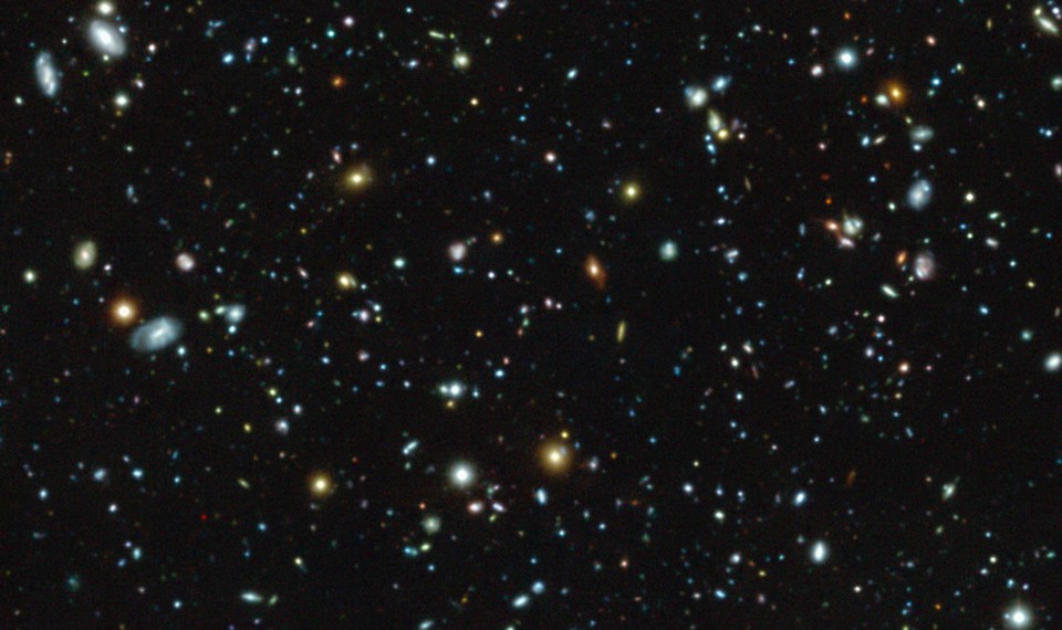 An image of galaxies and star clusters in space