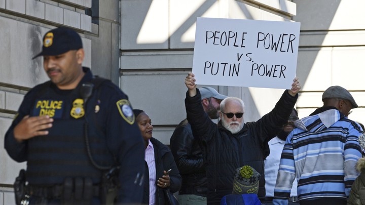 A protester outside a federal courthouse in Washington where Michael Flynn appeared with his lawyers