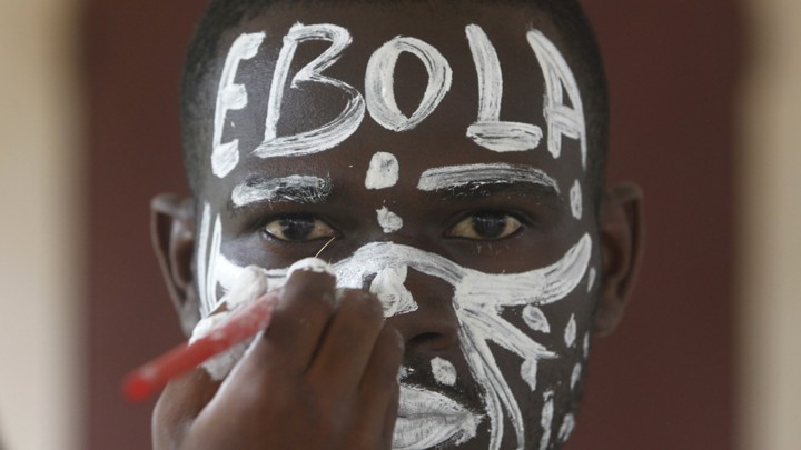 An actor with "EBOLA" written across his forehead