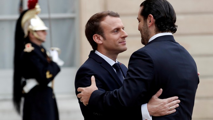 Emmanuel Macron and Saad al-Hariri embrace.