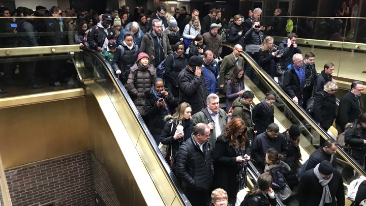 Commuters exit the New York Port Authority after reports of an explosion.