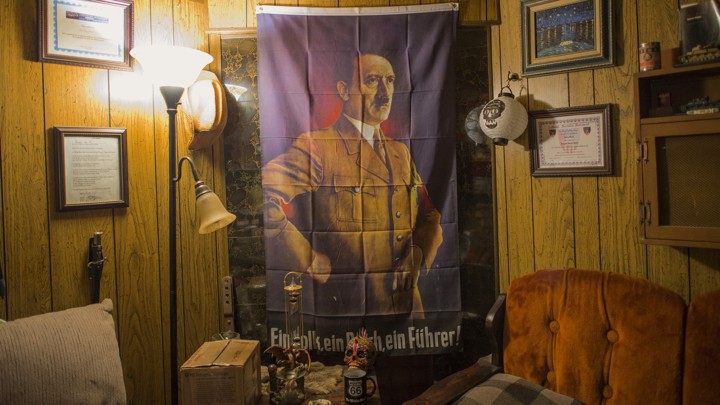 An image of Adolf Hitler hangs inside a home where members affiliated with the Ku Klux Klan and the National Socialist Movement were gathering for a joint rally in Hunt County, Texas, in 2014.
