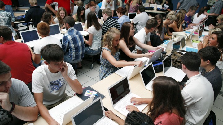 Rows of students using laptops.