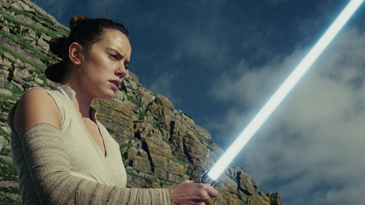 Rey holding a lightsaber in 'Star Wars: The Last Jedi'
