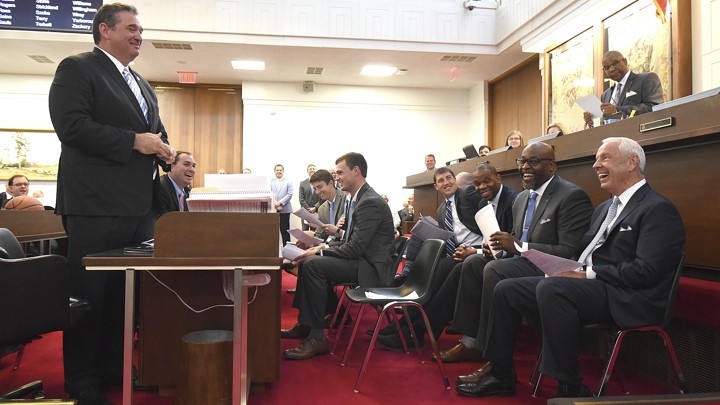 Representative David Lewis (left) and an overrated basketball coach (right)
