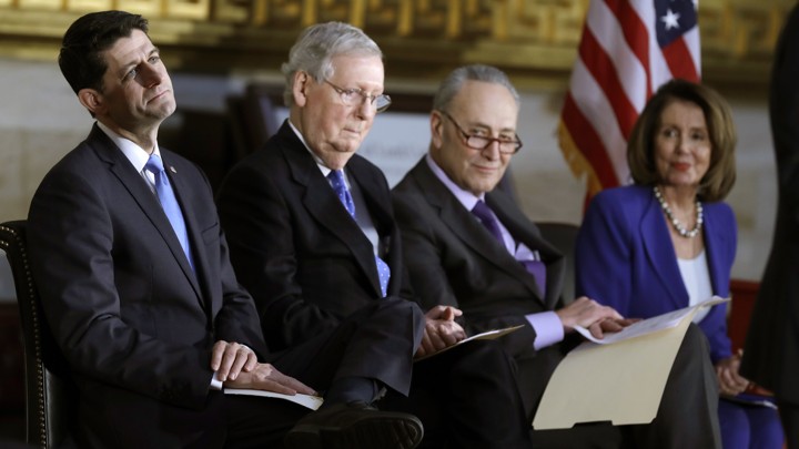 House Speaker Paul Ryan, Senate Majority Leader Mitch McConnell, Senate Minority Leader Chuck Schumer, and House Minority Leader Nancy Pelosi seated together