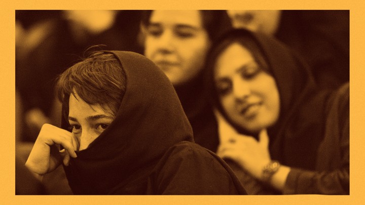 An Iranian student hides her face during a protest against the renewed death sentence of a professor accused of blasphemy, Hashem Aghajari, in 2004 at Tehran University.