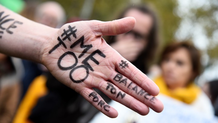 A picture shows the messages '#Me too' and #Balancetonporc ('expose your pig') on the hand of a protester.