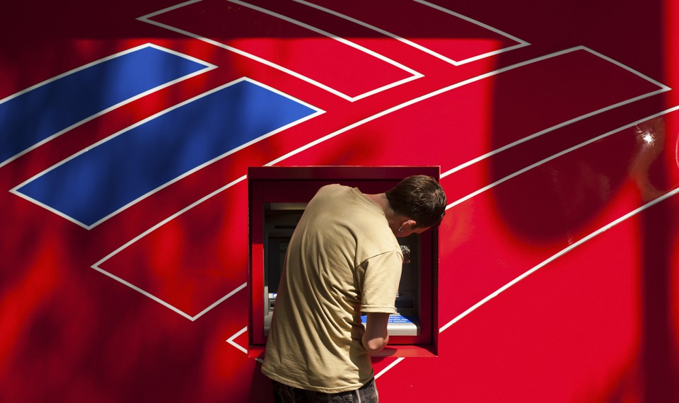 A man using a Bank of America ATM