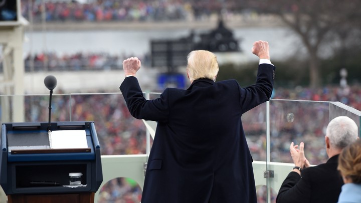 President Trump pumps his fists into the air.