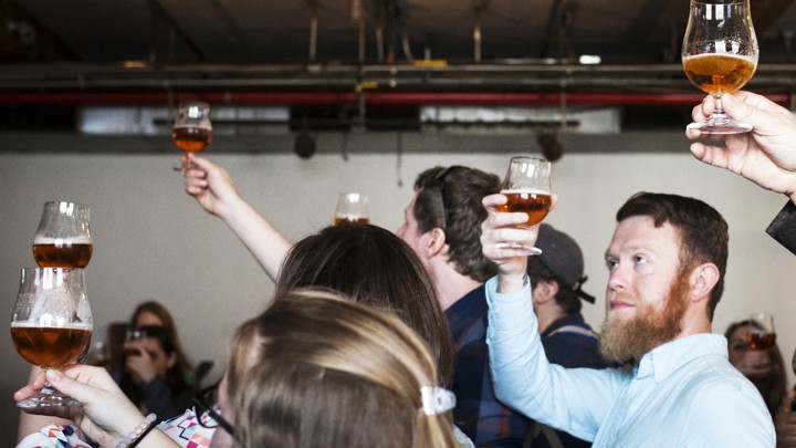 Visitors taste beer at Brooklyn Brewery, in New York