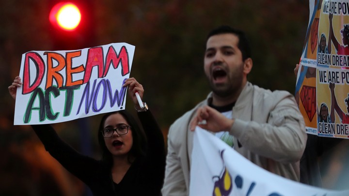 A small group of demonstrators block traffic to demand action by the federal government on the Deferred Action for Childhood Arrivals