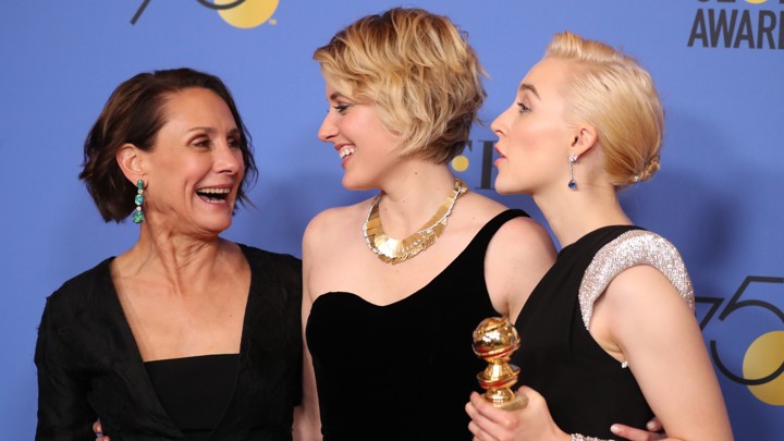 Laurie Metcalf, Greta Gerwig, and Saoirse Ronan pose backstage with their Best Motion Picture: Musical or Comedy award for 'Lady Bird.'.