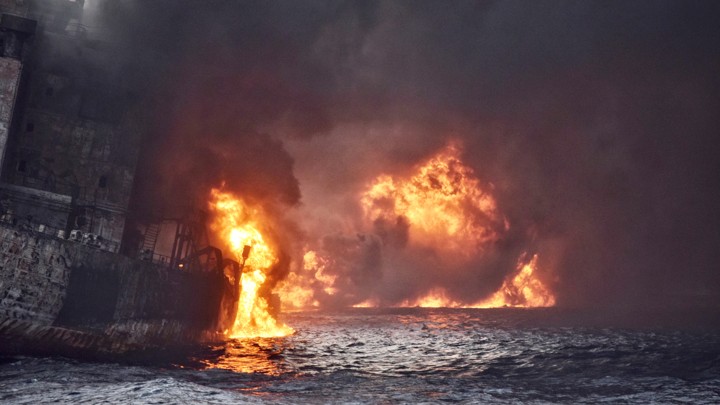 An oil tanker engulfed in flame