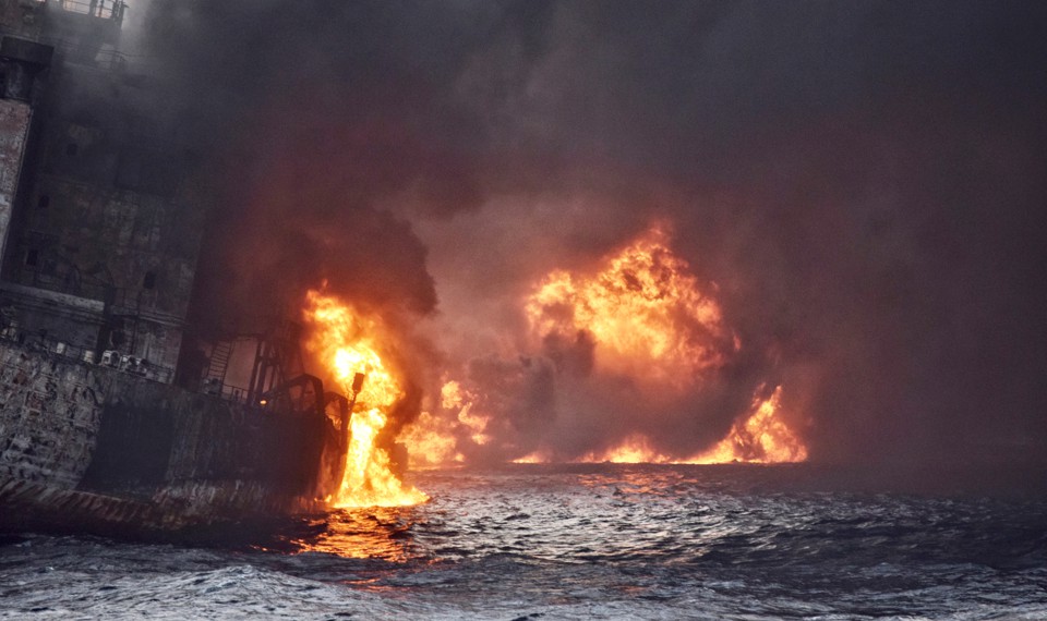 An oil tanker engulfed in flame
