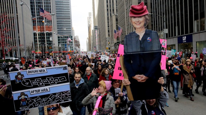 People carrying a poster of Hillary Clinton take part in the Women's March in Manhattan in New York City, New York, U.S., January 20, 2018