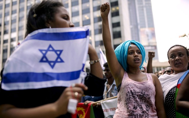 A migrant from Eritrea gestures during a protest in Israel.