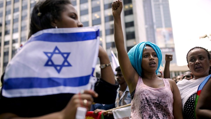 A migrant from Eritrea gestures during a protest in Israel.