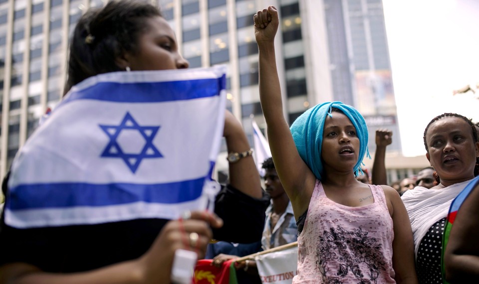 A migrant from Eritrea gestures during a protest in Israel.