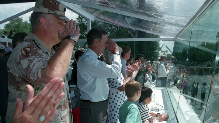 General Norman Schwarzkopf and President George H.W. Bush salute troops at the victory parade in Washington on June 8, 1991.