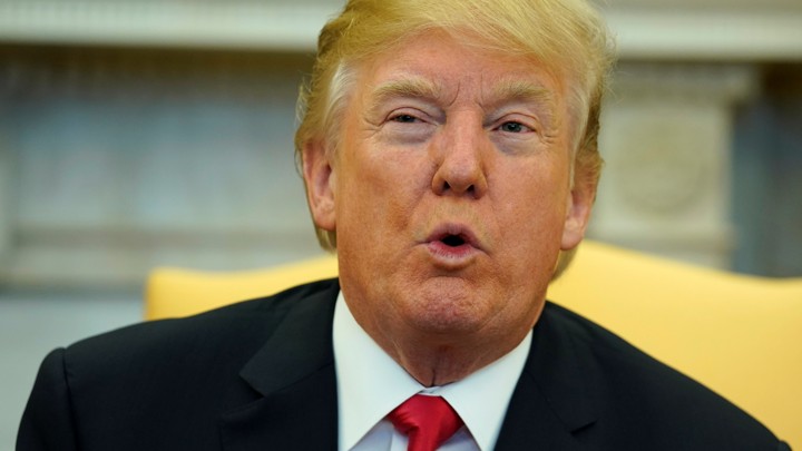President Trump talks to the media in the Oval Office of the White House on February 2, 2018.