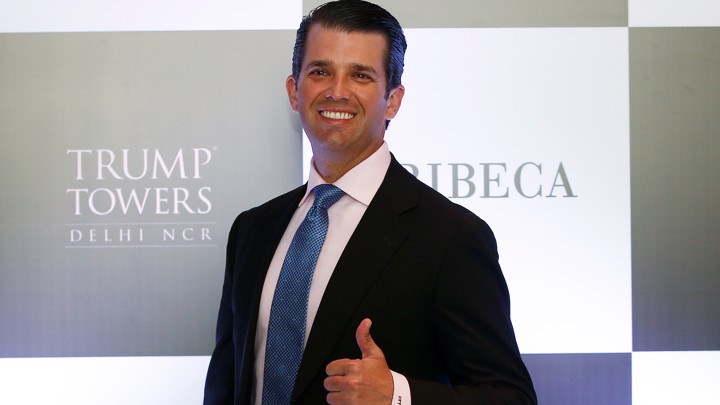 Donald Trump Jr. smiles and flashes a thumbs-up