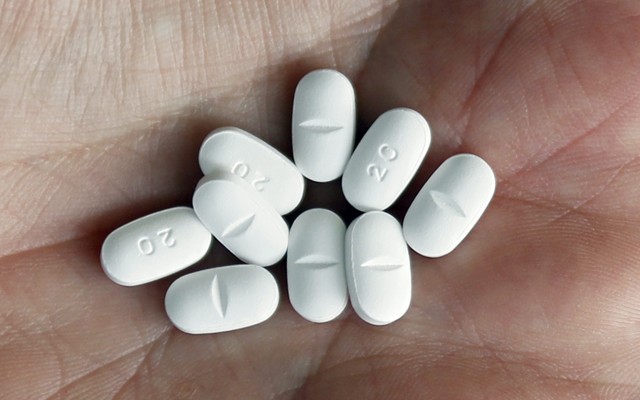 White pills resting in a palm 