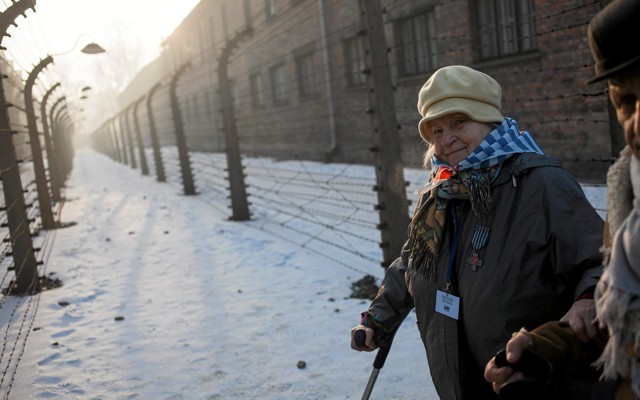 Survivors walk in Auschwitz-Birkenau in Oswiecim, Poland, in 2017.