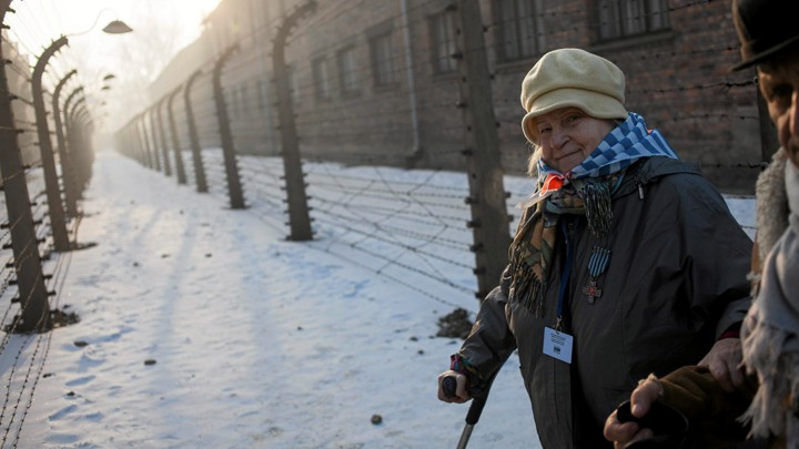 Survivors walk in Auschwitz-Birkenau in Oswiecim, Poland, in 2017.