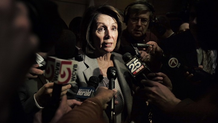 House Minority Leader Nancy Pelosi surrounded by reporters