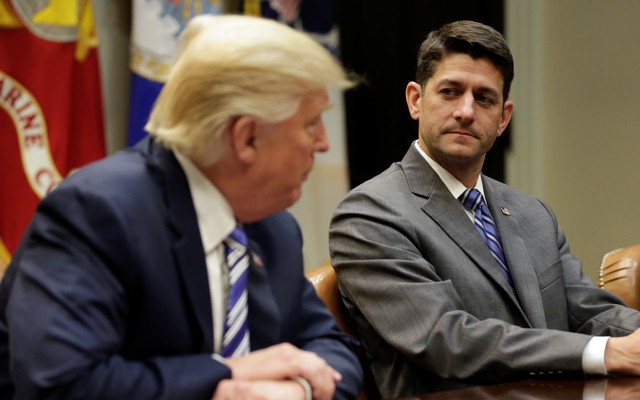 House Speaker Paul Ryan and President Trump sitting at a table during a meeting.
