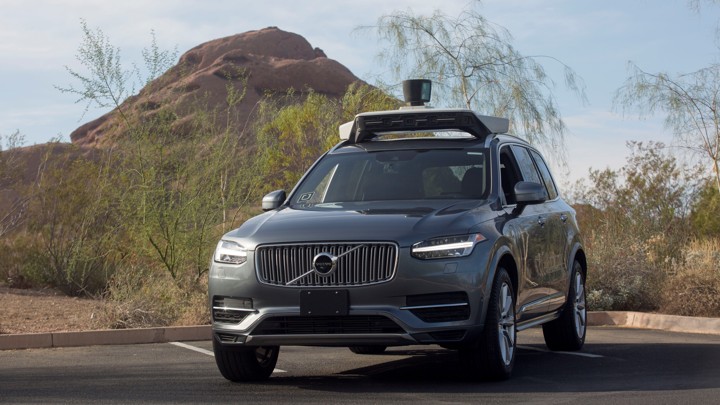 An autonomous SUV in a parking lot