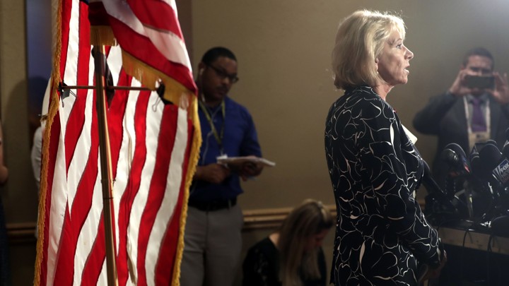 Betsy DeVos speaks at a news conference.