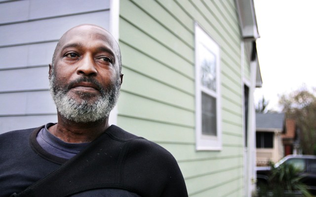 Man in front of home
