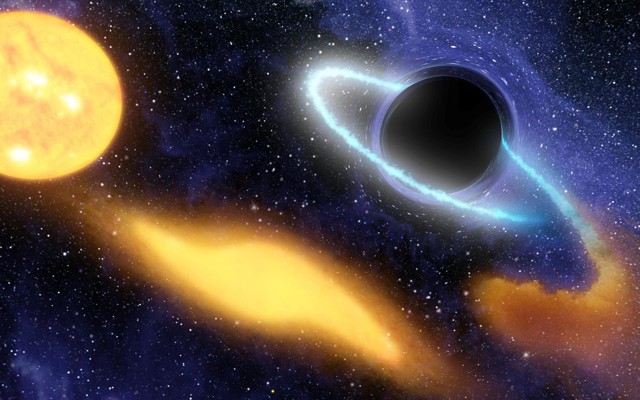 An illustration of a supermassive black hole digesting the remnants of a star