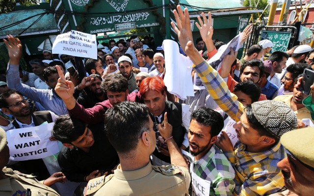 Protesters shouting at policemen