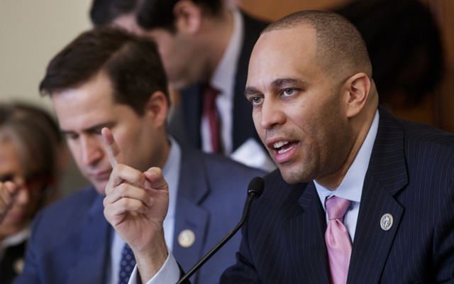 Representative Hakeem Jeffries of New York speaks into a microphone