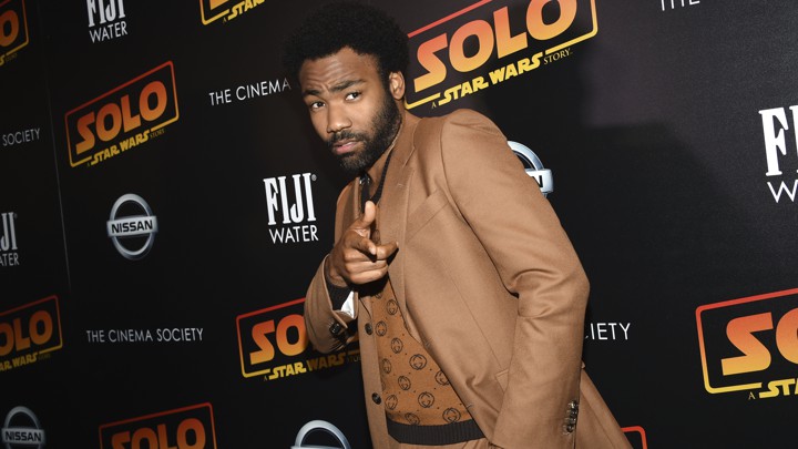 Donald Glover points at a premiere event for "Star Wars: Solo."