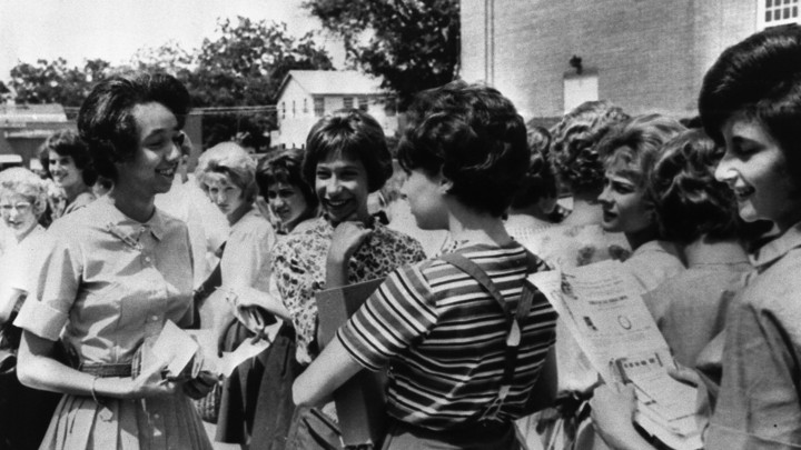 Millicent Brown smiling and talking with white classmates