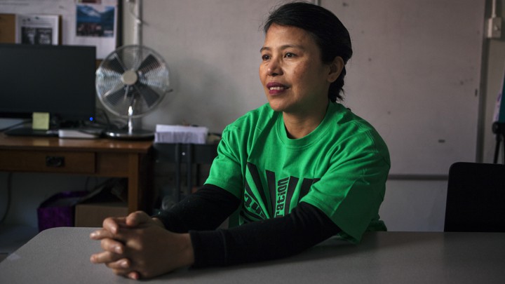 Edith Mendoza sitting smiling at a table