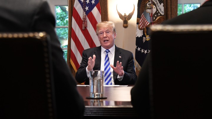 President Trump sits in the Cabinet Room of the White House.