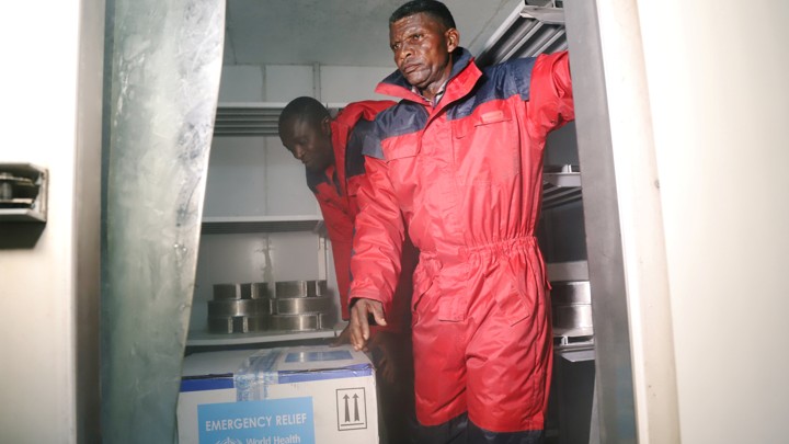 Congolese health officials arrange the first batch of experimental Ebola vaccines in Kinshasa.