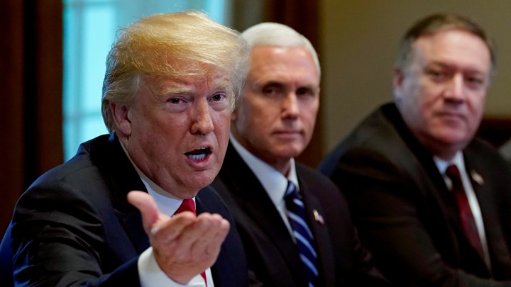 Vice President Mike Pence and Secretary of State Mike Pompeo listen as President Trump speaks during a meeting.