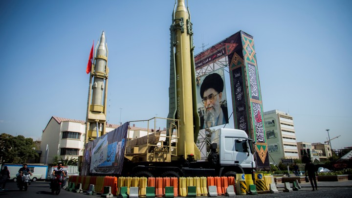 A display with missiles and a portrait of Ayatollah Ali Khamanei