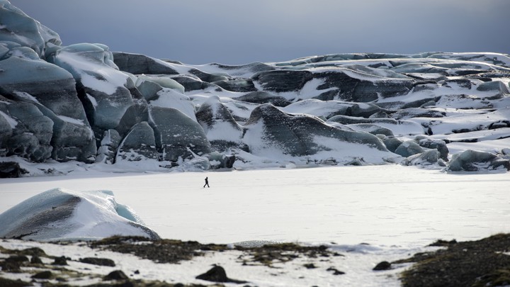 A figure walking in the snow
